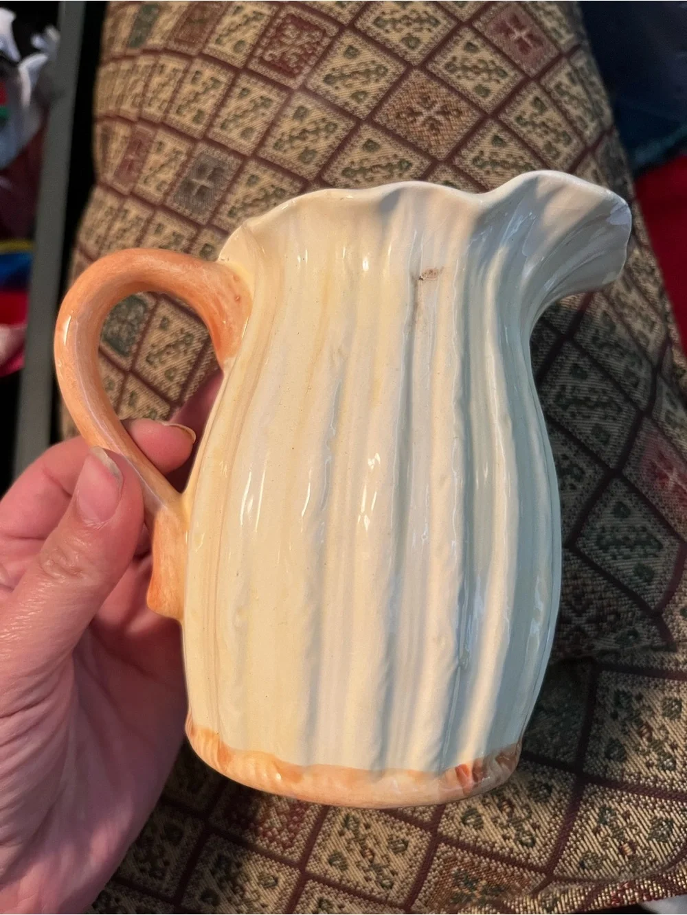 vintage Majolica-style ceramic pitcher features a vibrant 3D embossed sunflower